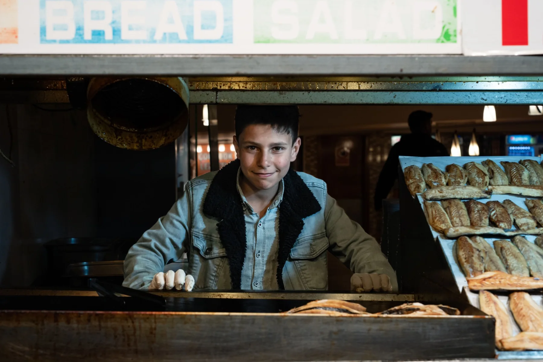 Young entrepreneur working at a bakery counter