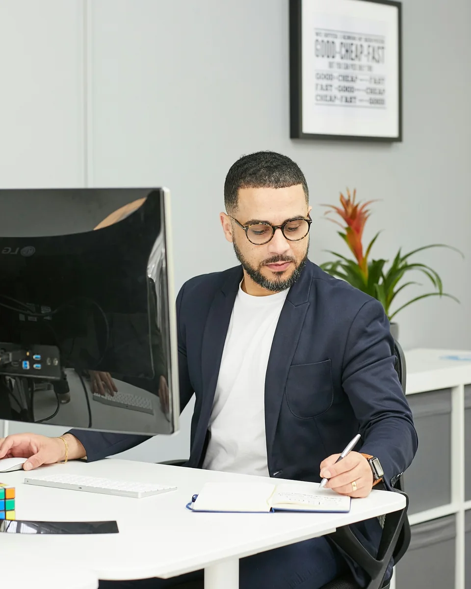Young professional planning work at a computer