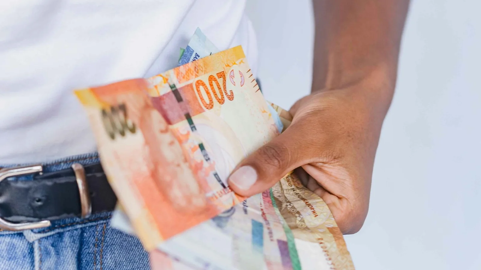South African rand banknotes held for everyday spending