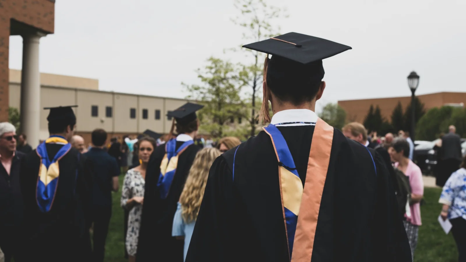 Graduates and families gathering after a university ceremony