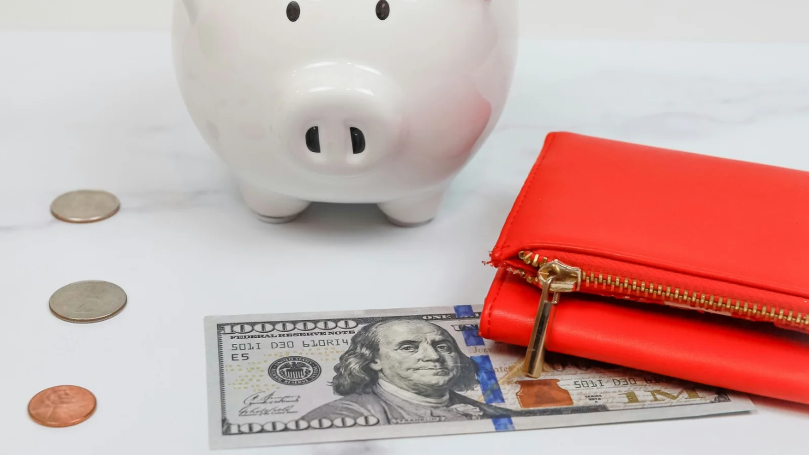 Piggy bank, wallet and cash representing a small investing start